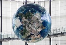Hanging digital Earth globe in modern atrium
