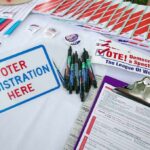 Democrats’ Texas Advantage Starts to Fade Voter registration table with forms, pens, and informational materials