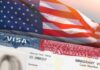 US visa document with American flag in background