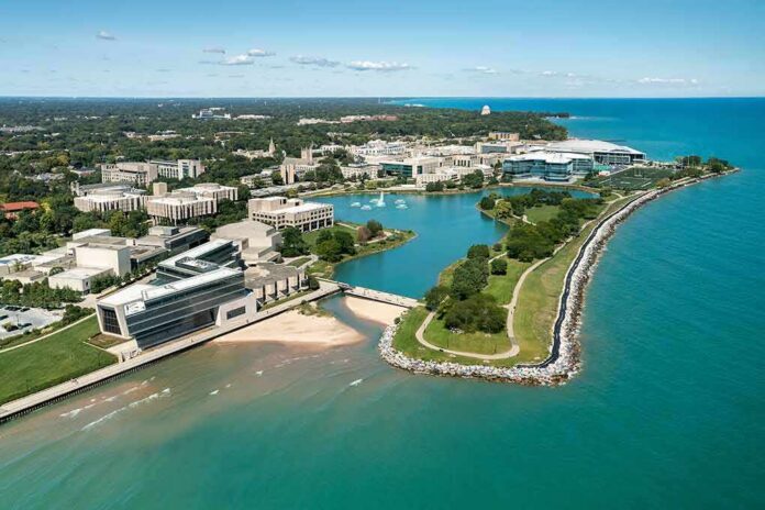aerial view of a lakeside university campus with lagoon and curved shoreline