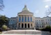 State capitol building with gold dome and columns