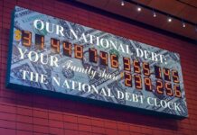 Economy Grows as Americans Say Life Feels Worse national debt clock sign with digital numbers