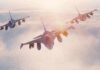 NATO Warns Attackers: “Block, Blunt, Break” Three fighter jets flying in formation above clouds at sunrise