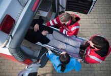 Seven Dead After Bus Attack in Homs Paramedics load a patient on a stretcher into an ambulance